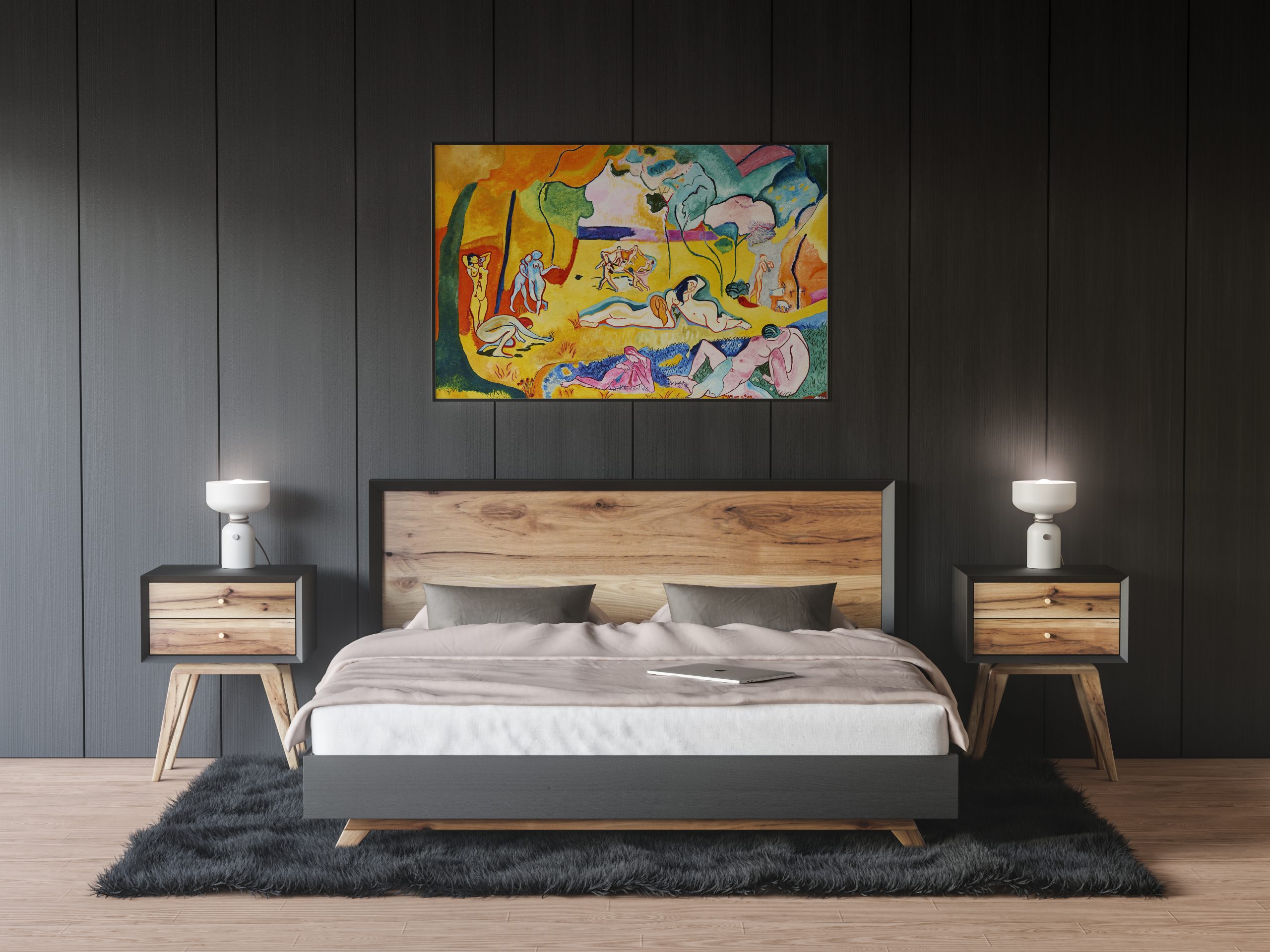 a painting is suspended above a bedding